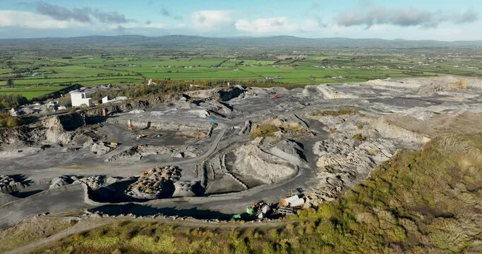 A huge quarry against the backdrop of a green valley 4k