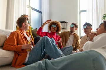 Foto op Plexiglas multiracial group of young friends playing charades drinking beer and having fun at home © Богдан Маліцький