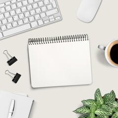 Office desk with office tools, plant, and a blank notebook