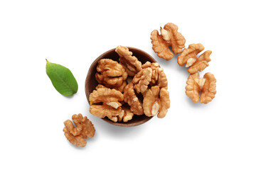 Bowl of tasty walnuts on white background