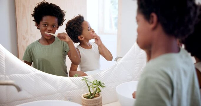 Children, brushing teeth and happy in mirror in bathroom, dental hygiene for self care in house. Siblings, african kids or smile by toothbrush, clean mouth reflection or learning oral health at home