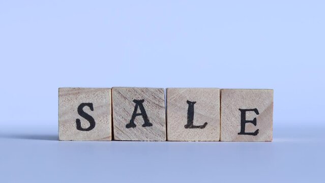 The words SALE are spelled with block letters in stop motion style