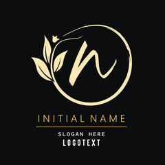 hand drawn N letters Logo design. Brushstroke N Letter Logo Design. luxury initial N logo design isolated leaf and flower.eps8