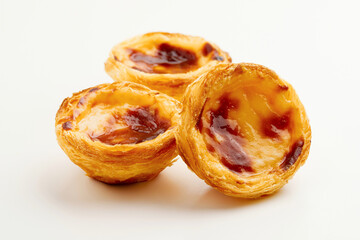 Traditional Portuguese egg tart dessert Pasteis Pastel de nata or Pasteis de Belem on white...