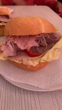 Video of traditional peruvian sandwich called "Butifarra" or "sandwich de lechon". Food concept.
