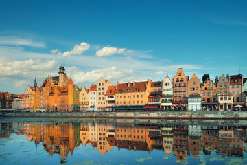 Cityscape of Gdansk with reflection under blue sky with clouds.