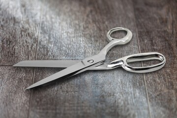 A pair of steel school scissors on a desk