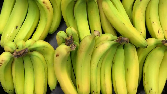 Video of fresh bananas at a local market. Food concept.