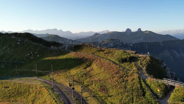 Aerial shot of train tracks on Rochers de Naye in the Swiss Alps, Switzerland