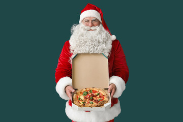 Santa Claus with box of tasty pizza on green background