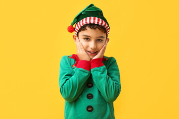 Cute little elf on yellow background