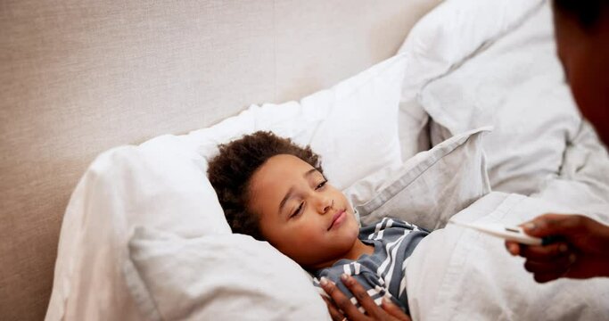 Fever, child and woman for healthcare in bed, talking and comfort for cold illness in bedroom. Black family, mother and son with care to monitor temperature for flu, support wellness and love at home
