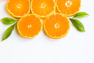 Fresh, natural round sliced tangerine with fresh green leaves and copy space,background