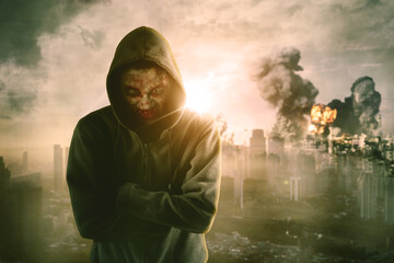 Face of zombie with destroyed city in background