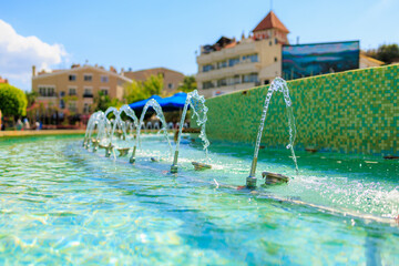 The trickles of the city fountain. Background with selective focus and copy space