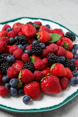 Different fresh ripe berries on table, closeup