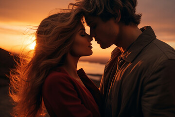 couple kissing at sunset