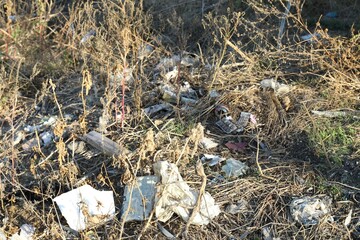 Different plastic garbage outdoors. Environmental pollution concept