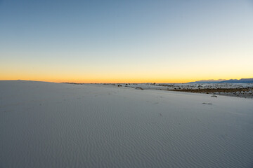Windblown Texture Covers The White Sand At Sunset