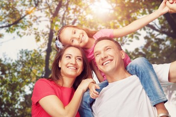 Family concept, happy young parents and children