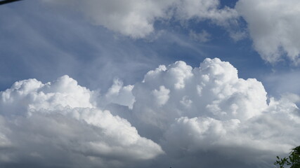 Blue sky fluffy white clouds on summer season bright clear skyline with beautiful cloudscape. Panorama blue sky clouds pattern on daylight with copy space. Cumulus cloudscape air climate sunny day © aFotostock