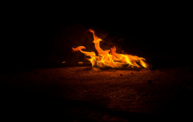 flames on dark background for background © serhii