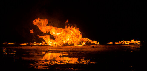 flames on dark background for background © serhii