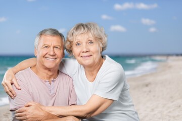 Happy senior couple spending time at the beach.