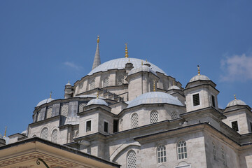 Fototapeta na wymiar dome of the Fatih Mosque against blue sky 