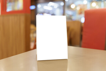 Menu mock up blank for text marketing promotion. Mock up Menu frame standing on wood table in restaurant space for text