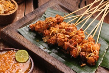Sate taichan is a variation of chicken satay grilled and served without peanut or ketjap seasoning...