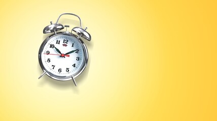 Alarm clock on yellow background. Christmas and Happy new year concept.