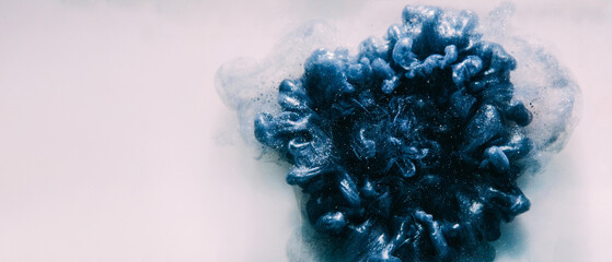 Ink drop background. Mysterious explosion. Steel dark blue glitter smoke puff flow abstract hypnotic magic splash shape spreading in white art empty space.