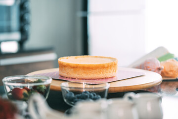 Sponge cake on cake stand place on kithcen table