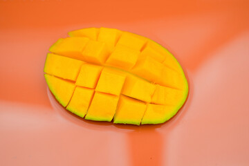 Fresh manggo fruit with orange background