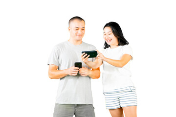 Happy young caucasian - asian couple using mobile phone