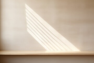 Empty beige wall for product display with sun shadow from window