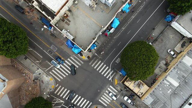 Top down drone shot rotating over streets of Skid Row, Los Angeles, USA