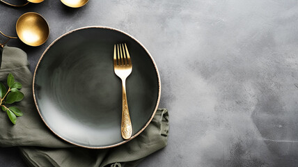 grey grunge background with copy space restaurant serving plate fork knife.