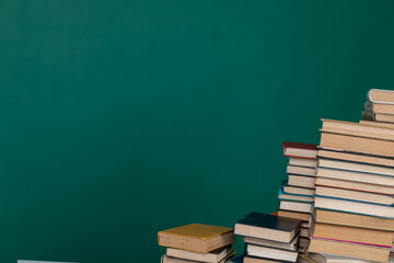 Stacks of Educational Books College University Library Green Background