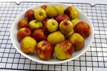 Fresh jujube fruit in white plate