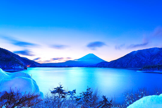 World Heritage Site - Snow on Mt. Fuji from Lake Motosu at dawn , Japan,Yamanashi Prefecture,Minamikoma District, Yamanashi February 2022