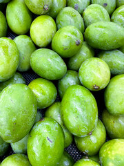 pile of fresh mango fruits closeup - healthy food background