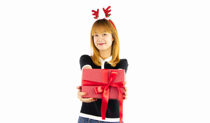 asian girl with reindeer headband holding christmas gift box isolated on white background