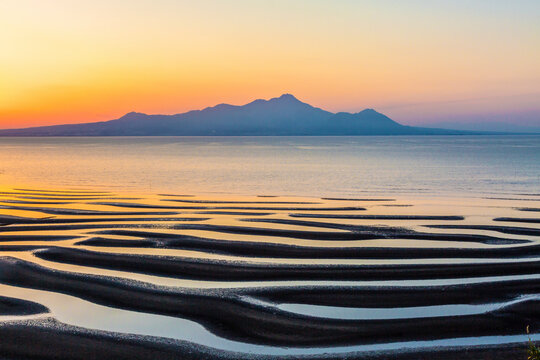 Sand pattern, sea, setting sun, and Mt. , Japan,Kumamoto prefecture,Uto-shi,Toguchi Town March 2017