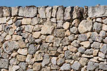 Close view of a ruin wall made of natural stone