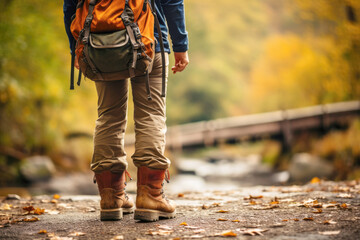 Hiking through the dense woods, a young woman's footwear takes center stage, showcasing the importance of reliable boots for outdoor adventures. - obrazy, fototapety, plakaty