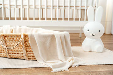 Fototapeta na wymiar Interior of nursery room with baby crib and cradle