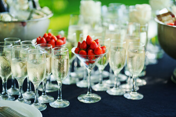 Strawberries in a glass as an appetizer for champagne at a banquet. 