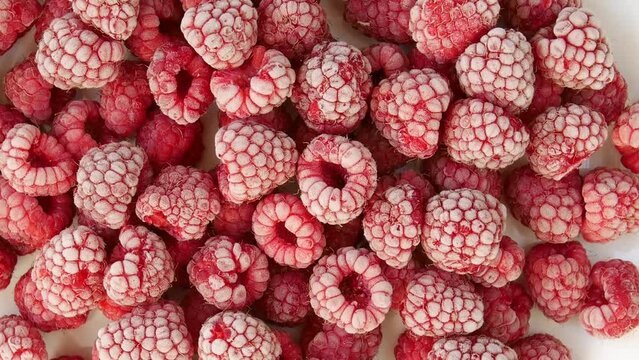 Frozen raspberries on a plate.